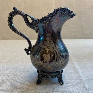 Roger A. Smith Co. silver footed pitcher.